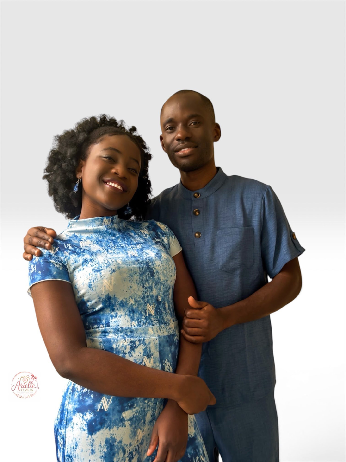 Busolami and Tunde embracing in their studio pre-wedding shoot